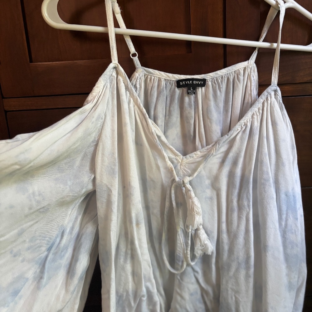 Off the shoulder light blue flowy shirt with tie in the front